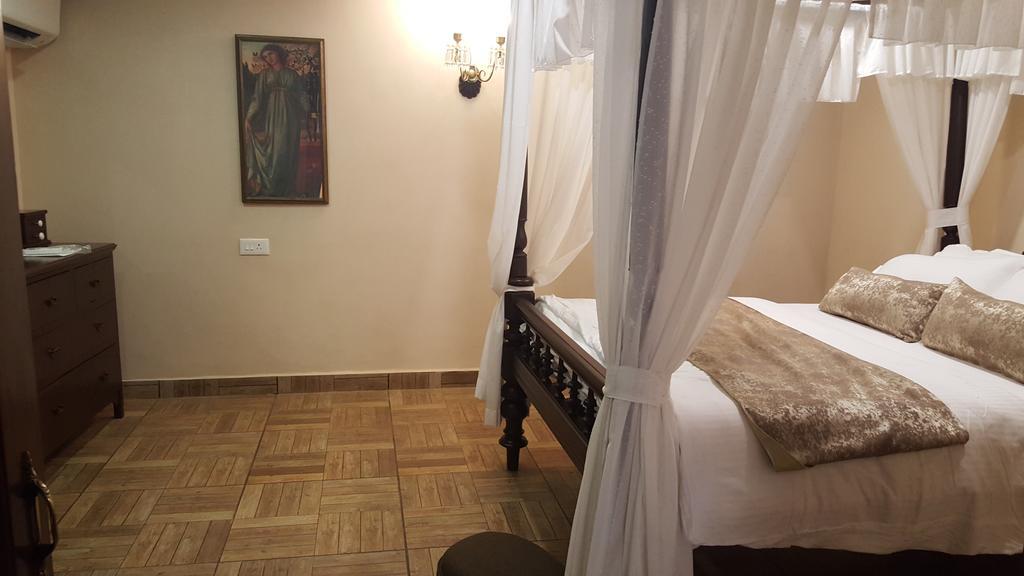 Casa Menezes - A Heritage Goan Homestay Bambolim Quarto foto