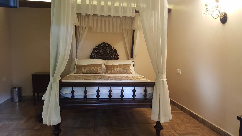 Casa Menezes - A Heritage Goan Homestay Bambolim Quarto foto
